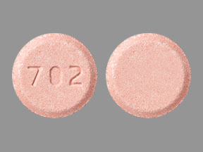 Pill 702 Peach Round is Bumetanide
