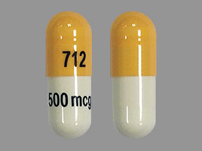 Pill 712 500 mcg Peach & White Capsule/Oblong is Dofetilide