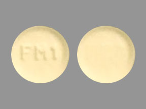 Pill FM 1 Beige Round is Methylphenidate Hydrochloride