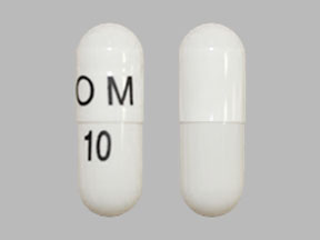 Pill OM 10 White Capsule/Oblong is Omeprazole Delayed-Release