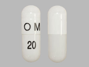 Pill OM 20 White Capsule/Oblong is Omeprazole Delayed-Release