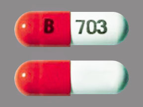 Pill B 703 Orange & White Capsule/Oblong is Ferrex 150 Plus