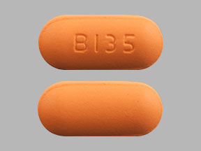 Pill B135 Orange Capsule/Oblong is Methocarbamol