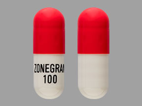 Pill ZONEGRAN 100 Red & White Capsule/Oblong is Zonegran