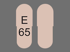 Pill E 65 Pink Capsule/Oblong is Omeprazole Delayed-Release