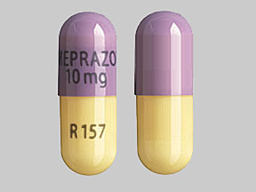 Pill OMEPRAZOLE 10mg R157 Purple Capsule/Oblong is Omeprazole Delayed Release