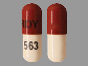 Pill RDY 563 Brown & White Capsule/Oblong is Atomoxetine Hydrochloride