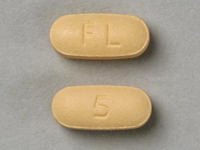 Pill FL 5 Tan Elliptical/Oval is Memantine Hydrochloride