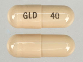 Pill GLD 40 Brown Capsule/Oblong is Doxycycline (Anhydrous) Immediate/Delayed Release