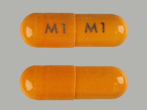 Pill M1 M1 Orange Capsule/Oblong is Doxycycline Monohydrate