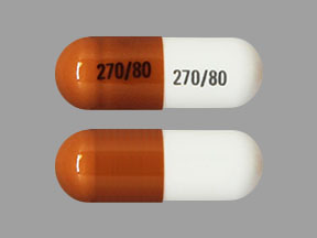 Pill 270 80 270 80 Brown & White Capsule/Oblong is Atomoxetine Hydrochloride
