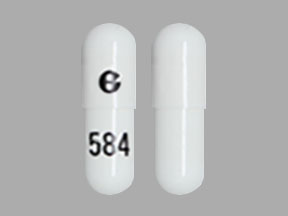 Pill G 584 White Capsule/Oblong is Aprepitant