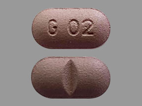 Pill G 02 Purple Capsule/Oblong is Colchicine