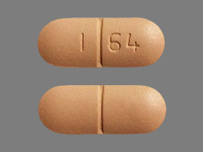 Pill I 64 Peach Capsule/Oblong is Doxycycline Monohydrate