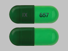 Pill IX 657 Green Capsule/Oblong is Hydroxyzine Pamoate