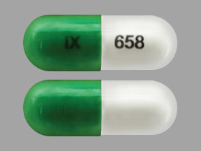 Pill IX 658 Green & White Capsule-shape is Hydroxyzine Pamoate