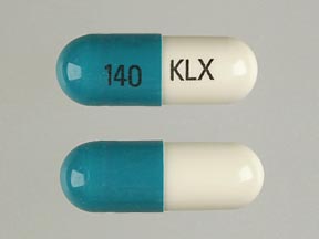 Pill KLX 140 Green & White Capsule/Oblong is Cephalexin Monohydrate