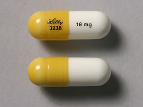 Pill Lilly 3238 18 mg Gold & White Capsule/Oblong is Atomoxetine Hydrochloride