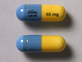 Pill Lilly 3239 60 mg Blue & Yellow Capsule-shape is Atomoxetine Hydrochloride