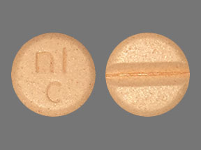 Pill nl c Orange Round is Carbidopa