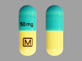 Pill M 50 mg Blue & White Capsule-shape is Clomipramine Hydrochloride