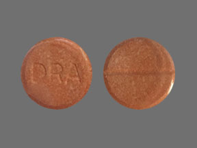 Pill DRA Orange Round is Dramamine (Chewable)