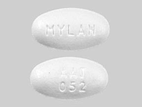 Pill AAT 052 MYLAN White Oval is Amlodipine Besylate and Atorvastatin Calcium