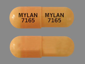 Pill MYLAN 7165 MYLAN 7165 Orange Capsule/Oblong is Celecoxib