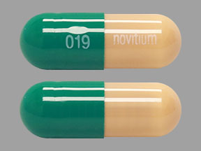 Pill 019 novitium Green Capsule-shape is Prazosin Hydrochloride