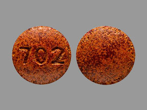 Pill 702 Brown Round is Phenazopyridine hydrochloride