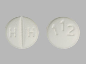 Pill HH 112 White Round is Losartan Potassium