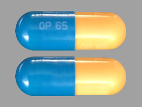 Pill OP65 OP65 Blue & Yellow Capsule/Oblong is Vancomycin Hydrochloride