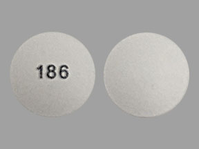 Pill 186 is Doxylamine Succinate and Pyridoxine Hydrochloride Delayed-Release 10 mg / 10 mg
