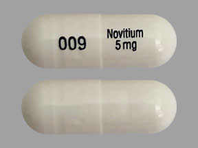 Pill 009 Novitium 5 mg White Capsule/Oblong is Nitisinone