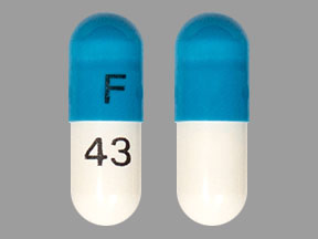 Pill F 43 Blue & White Capsule-shape is Atomoxetine Hydrochloride