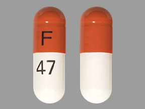 Pill F 47 Brown & White Capsule/Oblong is Atomoxetine Hydrochloride