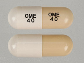 Pill OME 40 OME 40 Brown & White Capsule/Oblong is Omeprazole Delayed Release