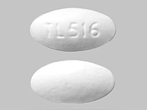 Pill TL516 is Vol-Tab Rx multivitamin with carbonyl iron 29 mg and folic acid 1 mg