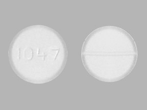 Pill 1047 White Round is Lamotrigine