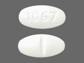 Pill 1067 White Oval is Valsartan