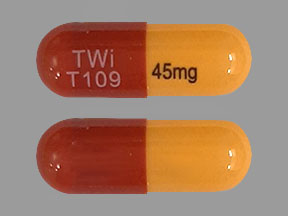 Pill TWi T109 45mg Brown & Yellow Capsule/Oblong is Fenofibric Acid Delayed-Release