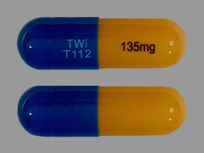 Pill TWi T112 135mg Blue & Yellow Capsule-shape is Fenofibric Acid Delayed-Release