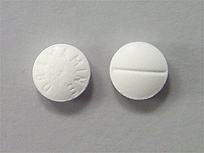 Pill DRAMAMINE White Round is Dramamine