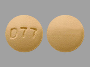 Pill D77 Beige Round is Doxycycline Hyclate