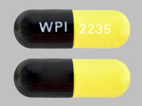 Pill WPI 2235 Black & Yellow Capsule/Oblong is Tetracycline Hydrochloride