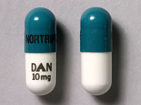 Pill NORTRIPTYLINE DAN 10 mg Green Capsule/Oblong is Nortriptyline Hydrochloride