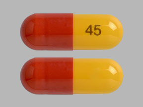 Pill 45 Brown & Yellow Capsule/Oblong is Fenofibric Acid Delayed Release