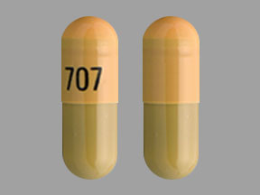 Pill 707 Orange & Yellow Capsule-shape is Doxycycline Monohydrate