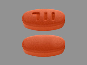 Pill 711 Brown Oval is Mesalamine Delayed-Release