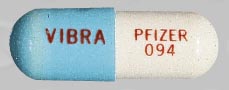 Pill VIBRA PFIZER 094 Blue Capsule/Oblong is Vibramycin